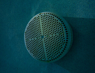 Pool suction equalizer, at night