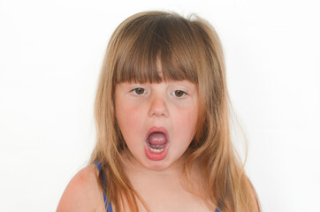 Surprised child opened his mouth on a white background isolated