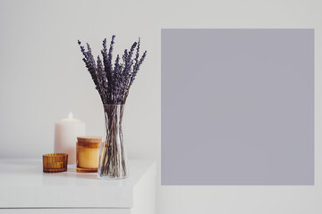 Minimal style home decor: dried lavender and aroma candles. Aromatherapy concept. Space for text, purple color