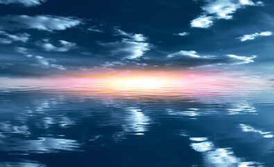 Obraz premium Summer landscape. Blue sea and blurry sky with fluffy clouds. Bright sunset on a tropical beach