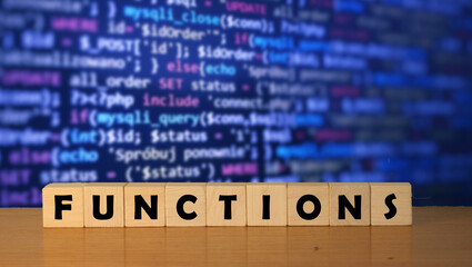 FUNCTIONS message word on a wooden desk on cube blocks with a software development background.