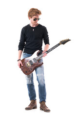 Young artist rock musician holding electric guitar preparing and getting ready. Full body length...