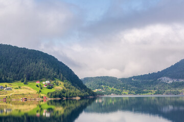 Fototapeta na wymiar Cloudy day on the fjord in Norway