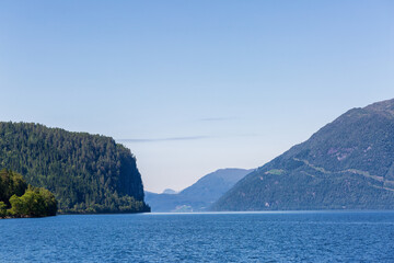 Blue sea and green mountains in Norway