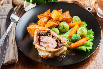 Pork tenderloin in wellington style in puff pastry