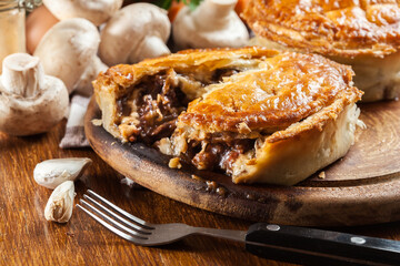Fresh beef stew pie on a cutting board