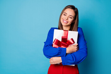Photo of attractive business lady hold arms big giftbox eyes closed present from boss colleagues wear red luxury trousers suit blouse shirt isolated blue color background