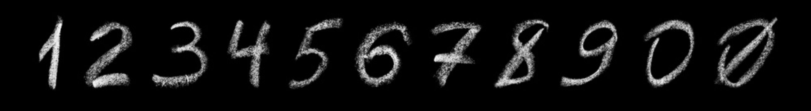 Set of arabic numbers handwritten in white chalk on a blackboard. Chalk numbers isolated on black background.