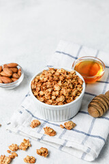 Homemade oatmeal granola bowl on white background.