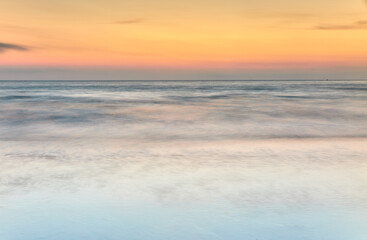 Fototapeta na wymiar abstract sunrise of soft colors, Laredo beach