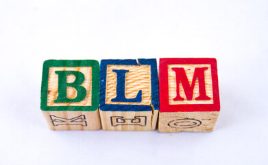 The hashtag BLM visually displayed on a clear background using colourful blocks image in horizontal...
