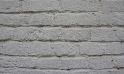 Texture of a brick wall painted white