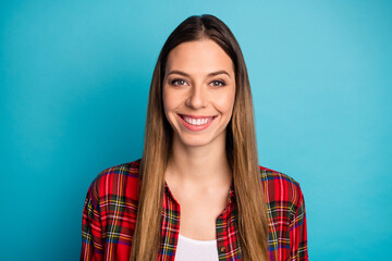 Obraz premium Close-up portrait of her she nice attractive pretty lovely cheerful cheery long-haired girl wearing checked shirt isolated over bright vivid shine vibrant blue color background