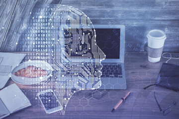 Multi exposure of work table with computer and brain hologram. Brainstorm concept.