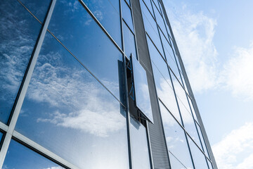 Fototapeta na wymiar blue glass building with the sky 