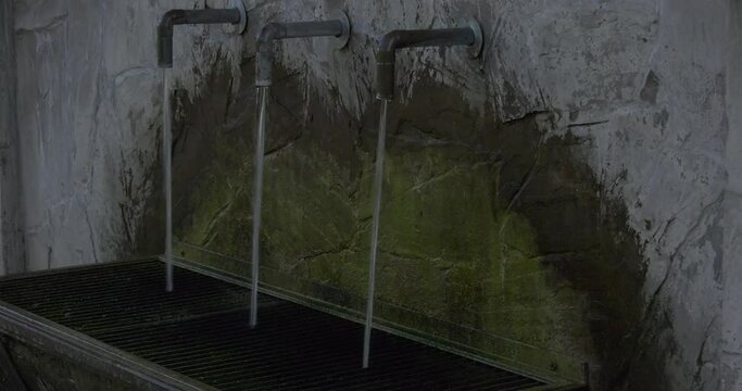 A running water taps in summer time in countryside