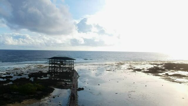 High view drone shot of the Cloud9 surfing tower in Siargao in the Philippines
