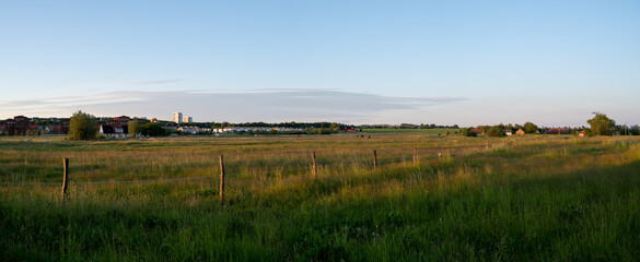 Panoramic view during sunset over the farmlands in the outskirts of the university town of Lund, Sweden