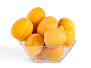 Apricots in the glass bowl isolated on white background, healthy food