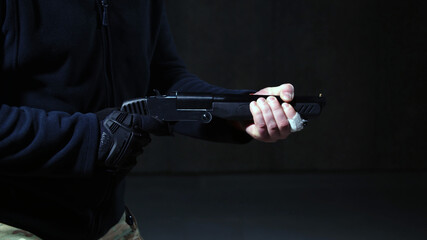 Criminal shoots with his lethal short-barreled shotgun .  - obrazy, fototapety, plakaty