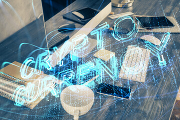 Double exposure of blockchain and crypto economy theme hologram and table with computer background. Concept of bitcoin cryptocurrency.