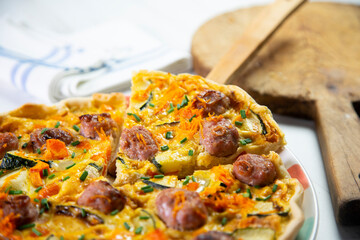French quiche with vegetables and sausage