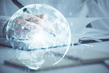 International business hologram over hands taking notes background. Concept of success. Multi exposure