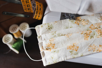 detail of a homemade cotton protective mask, close up on a sewing machine
