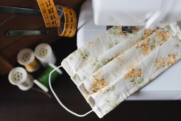 detail of a homemade cotton protective mask, close up on a sewing machine