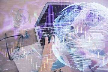 Multi exposure of forex graph with man working on computer on background. Concept of market analysis.