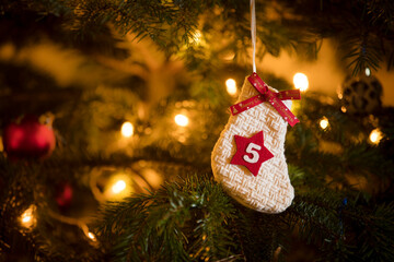 Traditional Advent Calendar Stocking with the date of the fifth of December hanging on a...