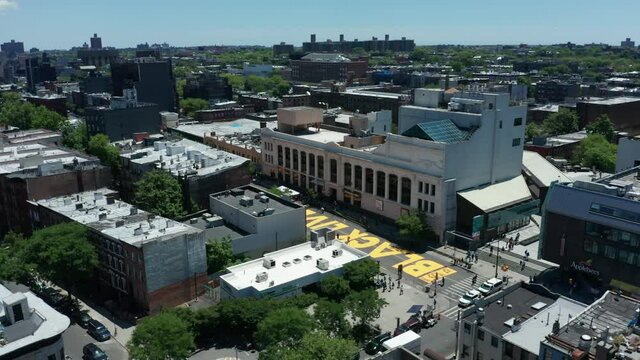 flying counter clockwise reveal of BLM sign on Fulton St. in Bed Stuy Brooklyn
