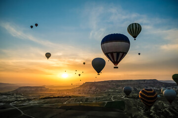 Aerial view of hot air balloons flying over spectacular at Cappadocia, Turkey. Goreme national park.