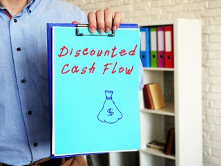 Business concept about Discounted Cash Flow with inscription on the sheet.