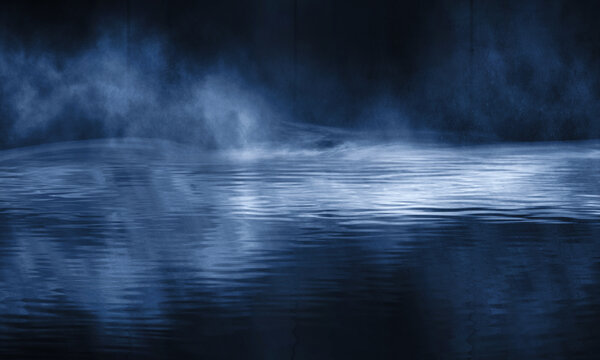 Dark empty scene, blue neon searchlight light, wet asphalt, smoke, night view, rays. Reflection on the water, night view. Liquid. 3d illustration. © MiaStendal