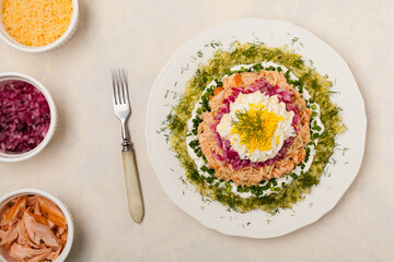 Traditional Russian Mimosa salad with salmon cheese and potatoes. Top view