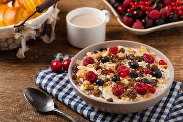 Breakfast, muesli with milk and fresh fruit.