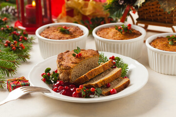Small, baked patties in Christmas decoration. Front view.