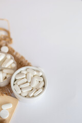 Vitamins and organic dietary supplements  to support human`s health and immunity on a white background.