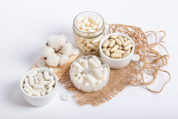 Vitamins and organic dietary supplements  to support human`s health and immunity on a white...
