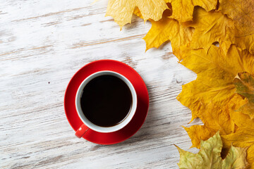 Flat lay autumn composition with cup of black tea