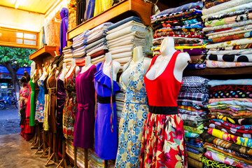 HOI AN, VIETNAM - SEPTEMBER 04, 2011: Clothing made to measure in a tailor in Hoi An, Vietnam on Sep 04, 2011.
