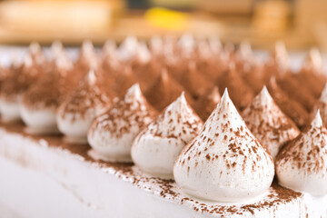 Cream cake with chocolate powder