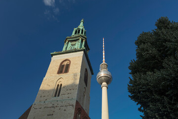 Berlin, Germany - 17th August 2018: Marienkirche and the Fernsehturm TV Tower near Alexanderplatz