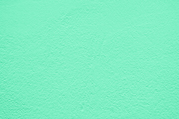 Green stucco texture. Architectural abstract background. Pistachio wall of building.