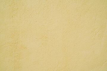 Yellow stucco texture. Architectural abstract background. Yellow wall of building.