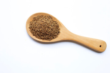 Cumin or caraway seeds on white background.