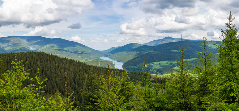 mountain lake beautiful landscape with spruce forests on the slopes and a river between the mountains, Beskydy Lysa hora czech