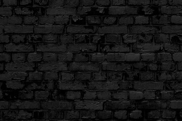 Black brick wall. Facade of an old building. Architectural background.
