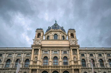 Fototapeta na wymiar Hoffburg Imperial Palace in Vienna, Austria. Luxurious baroque facade and gloomy rainy sky